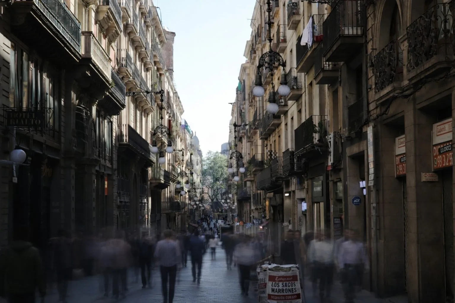 Passing Faces: a crowded Barcelona street, people blurred in motion