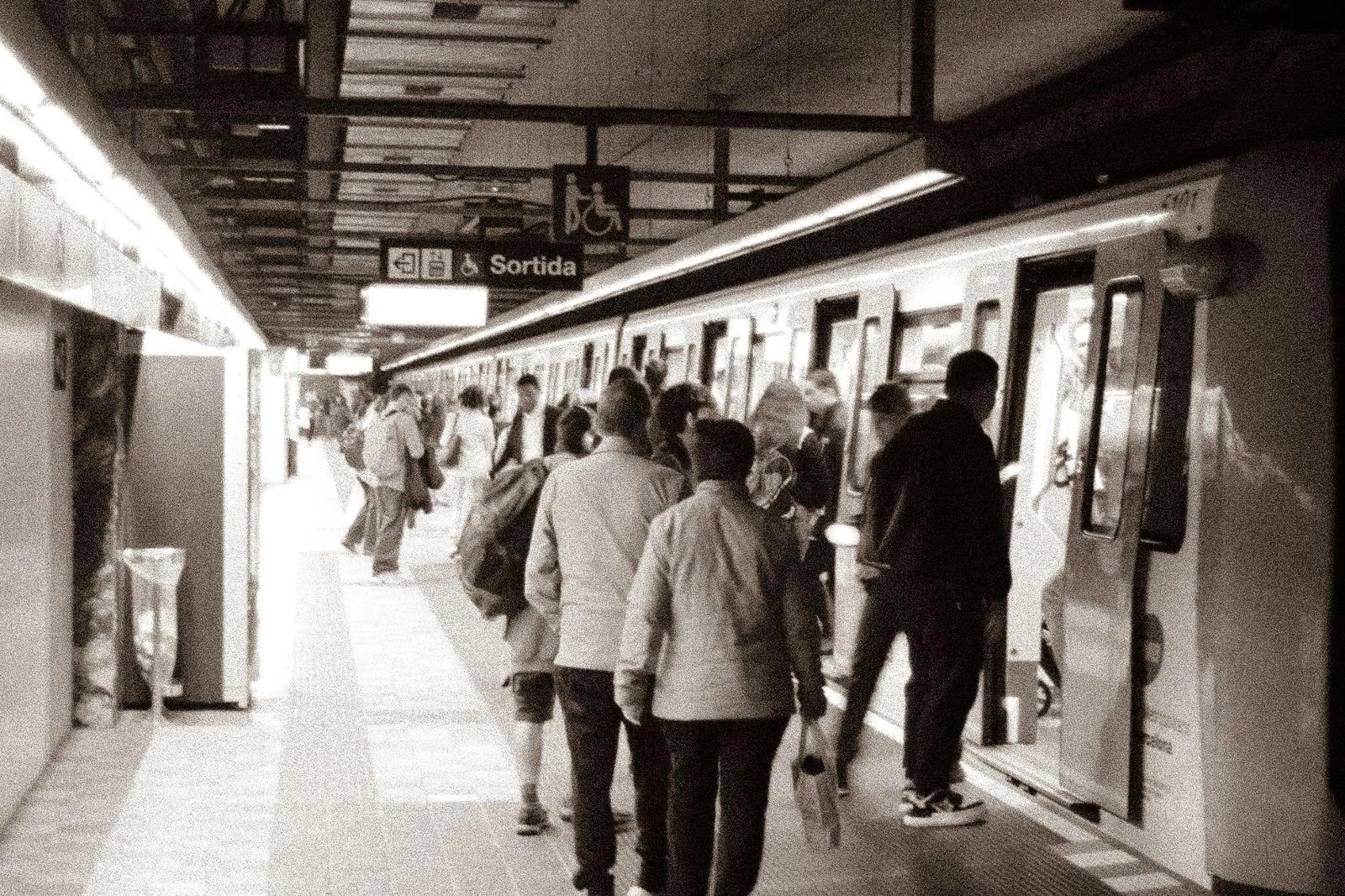 Rush Hour: commuters boarding a Barcelona metro train, in black and white
